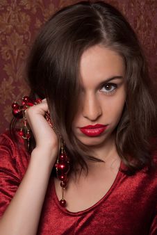 This Is A Beautiful Girl With Red Beads Royalty Free Stock Image This Is A Beautiful Girl With Red Beads Royalty Free Stock Image