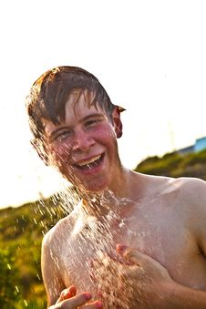 Boy Has A Shower At The Beach Stock Photography