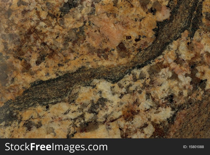 Surface of the granite. Reddish-brown shades.