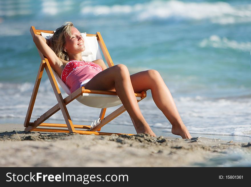 Young girl relaxing on sea background