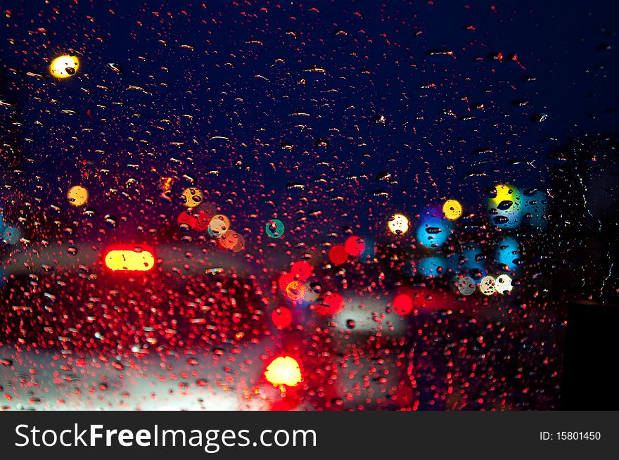 Water drop on glass with colorful lighting