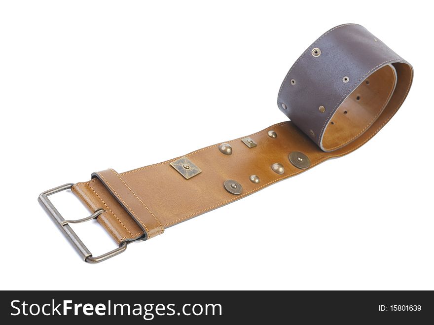 Brown leather belt with rivets. Isolated on white background. Brown leather belt with rivets. Isolated on white background
