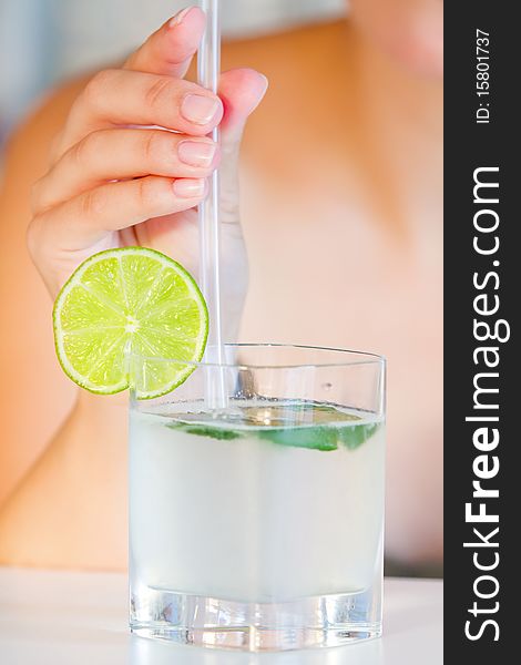 Girl Holding Straw In Lime Juice