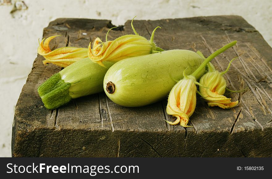 Zucchini on wooden table