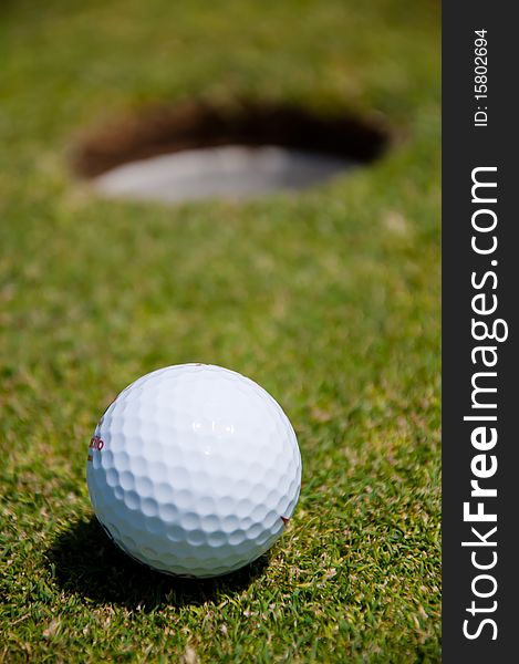 Golf hole with ball, sport