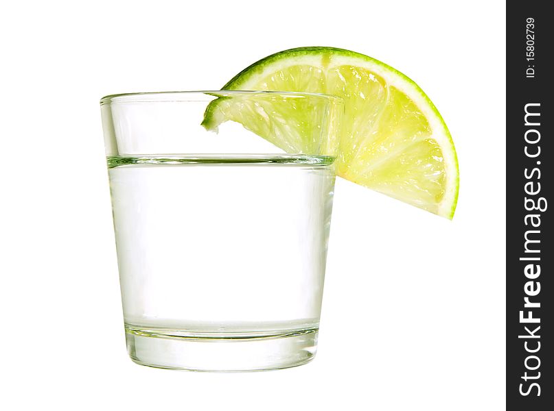 Wine-glass with a lime isolated on a white background