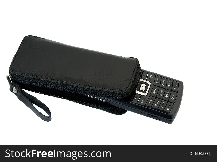 The black mobile phone packed into a leather case. The black mobile phone packed into a leather case