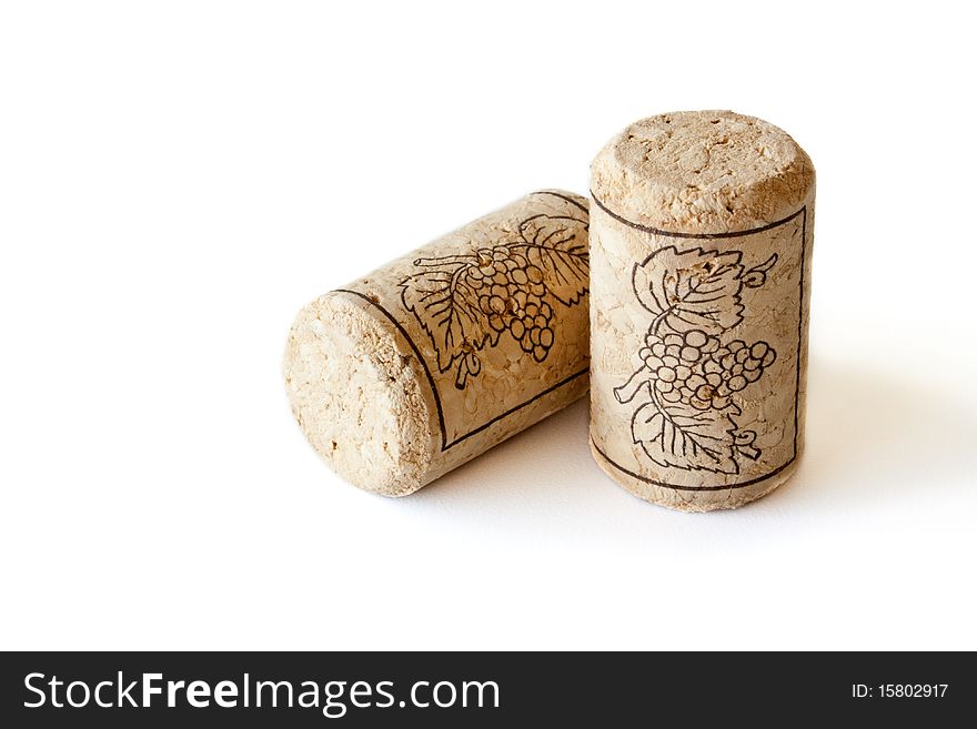 Two wine corks isolated on white background