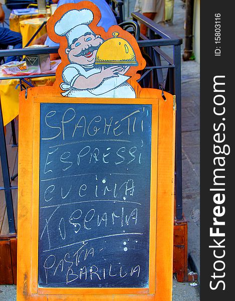 An Italian Restaurant menu board detailing Spaghetti ,Pasta and Espressi