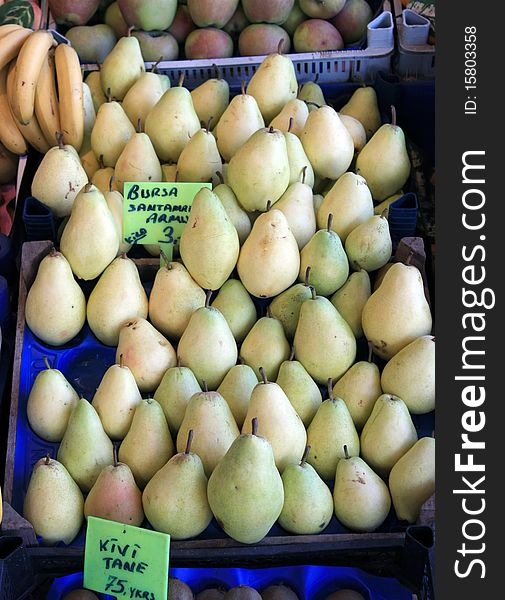 A vieq of pear in the greengrocer. It's seem fresh.