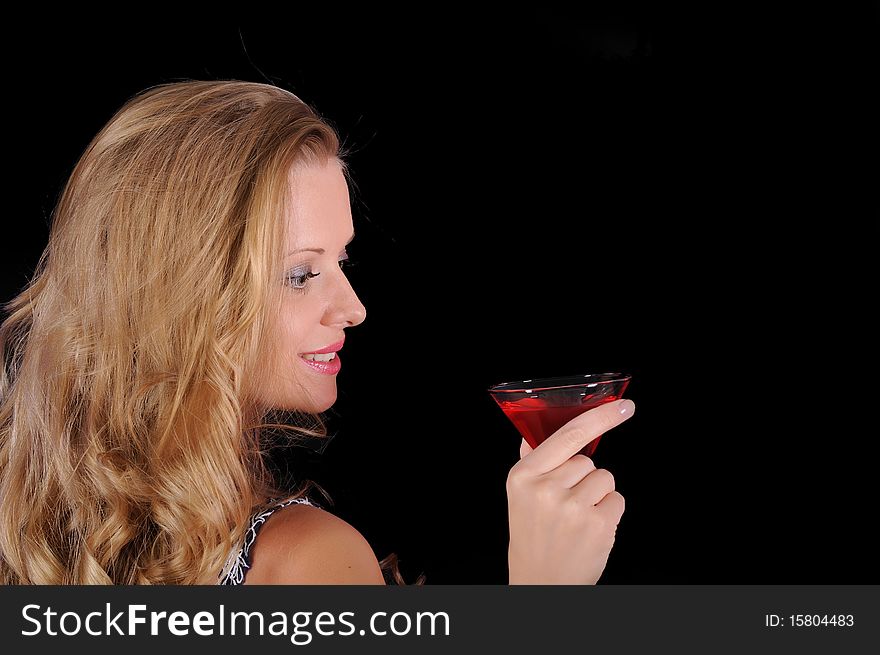 Young girl with a glass and a glass of red drink.