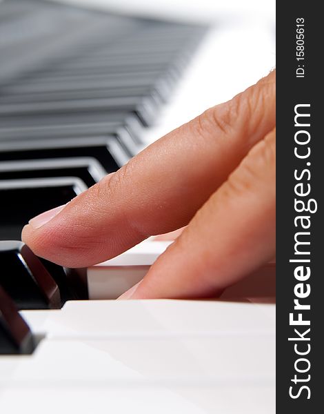 Close-up of a electronic piano keyboard on white