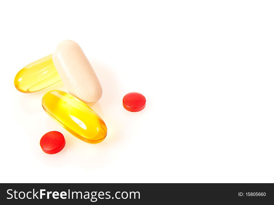 Various colorful drug pills and tablets isolated on white