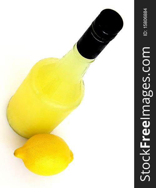 Natural Organic Lemon Juice and a lemon isolated on a white background