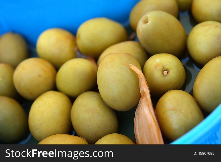 Several green olives close up