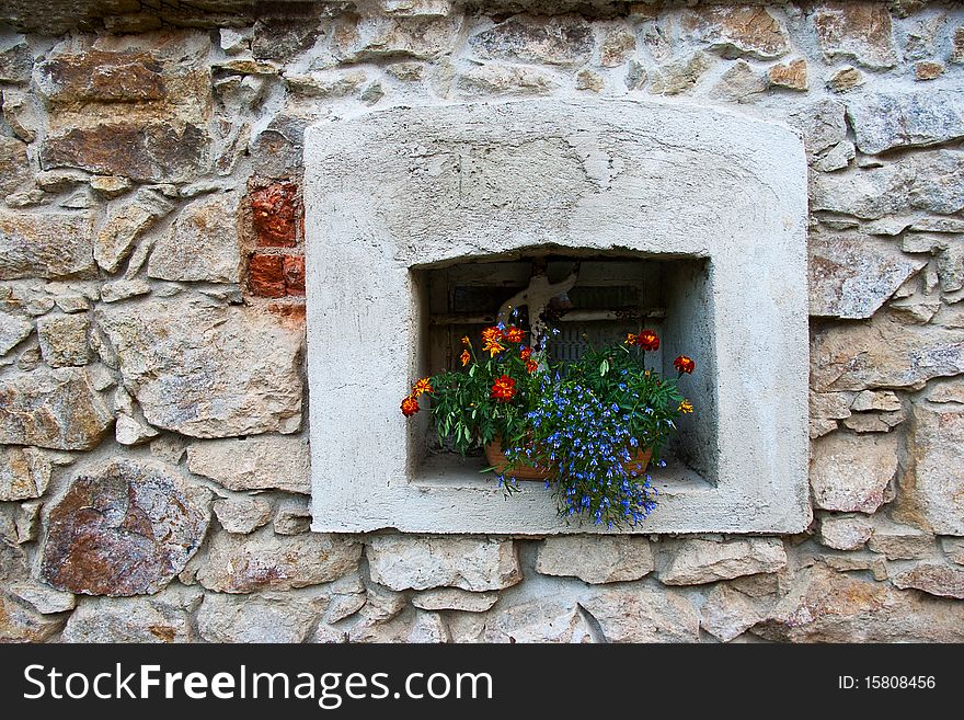 The old window with flowers