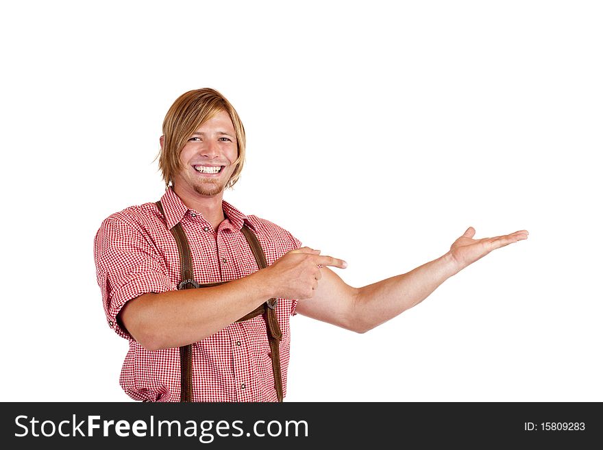 Bavarian man with oktoberfest leather trousers (Lederhose) points with finger on open palm.  Isolated on white background. Bavarian man with oktoberfest leather trousers (Lederhose) points with finger on open palm.  Isolated on white background.