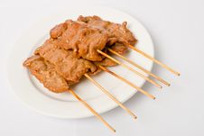 Barbecued Meats On White Dish Stock Image
