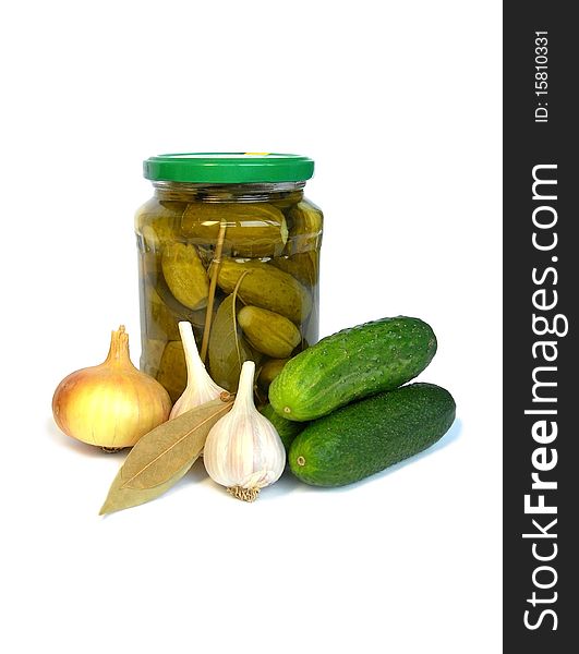Bank of pickled cucumbers and ingredients for marinating shown in the picture. Bank of pickled cucumbers and ingredients for marinating shown in the picture.