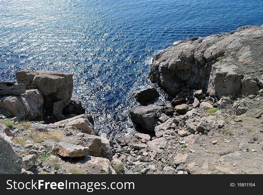 Beautiful dark blue sea with rocks on the path of Golicina of peninsula Crimea in Ukraine. Beautiful dark blue sea with rocks on the path of Golicina of peninsula Crimea in Ukraine