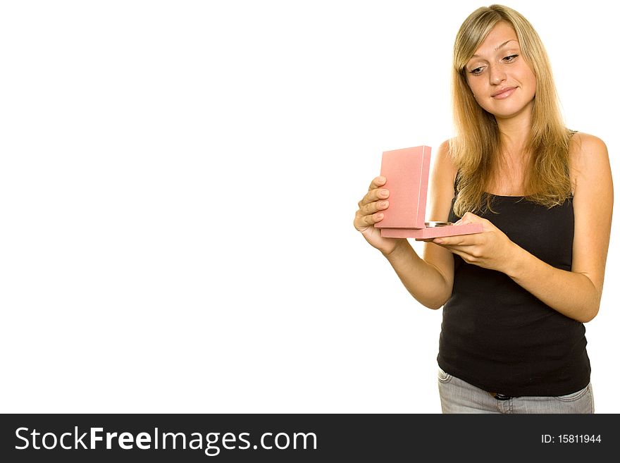 Beautiful young girl opens a gift box. Expressive of joy. Lots of copyspace and room for text on this isolate. Beautiful young girl opens a gift box. Expressive of joy. Lots of copyspace and room for text on this isolate