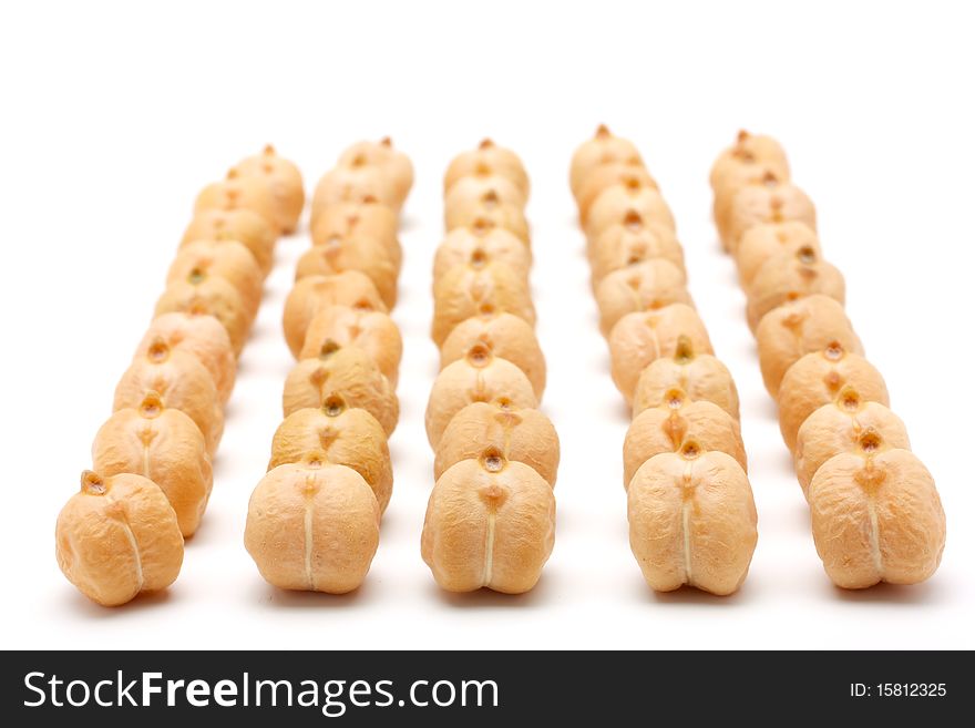 Seeds of chickpea posted several neat rows. Isolated on white background. Seeds of chickpea posted several neat rows. Isolated on white background.