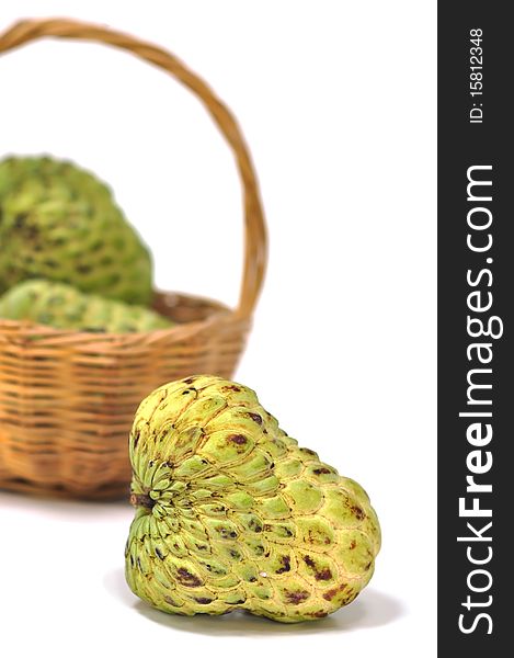 A basket of custard apple in the white background