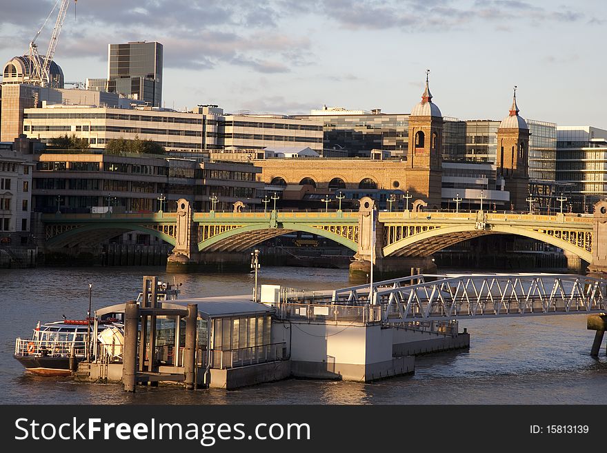 Southwark Bridge on the River Thames and Cannon Street Railway Station, London
