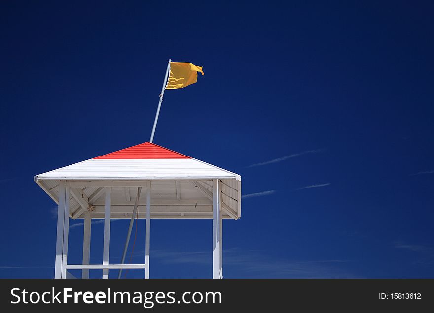 Yellow Caution Flag in the Lifeguard station