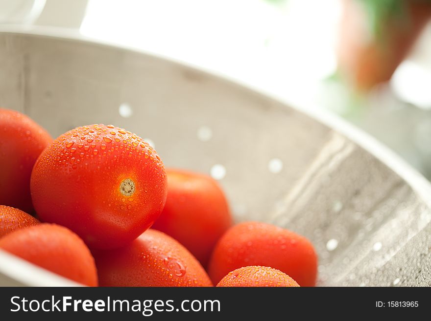 Roma Tomatoes In Colander With Water Drops