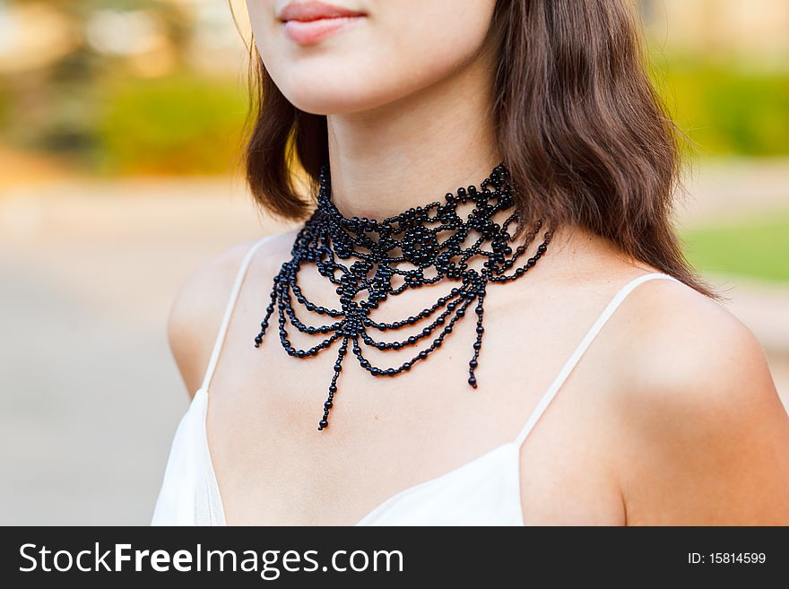 Beautiful adornment on neck of young woman