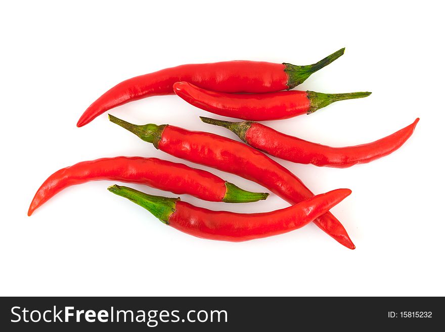 Heap of red hot chili pepper isolated on white background