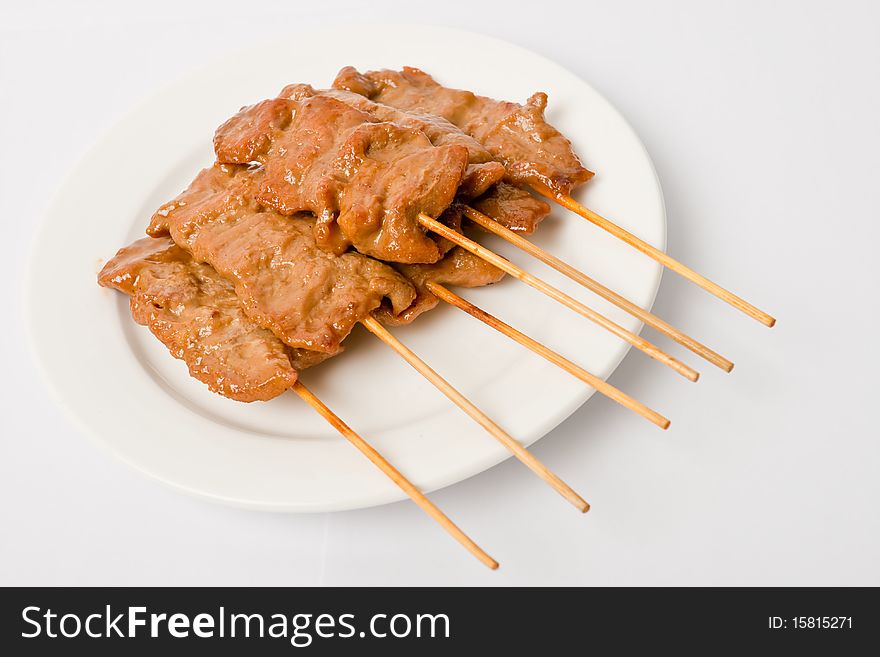 Barbecued Meats On White Dish