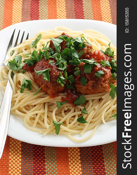 Spaghetti with meatballs in tomato sauce and parsley. Spaghetti with meatballs in tomato sauce and parsley