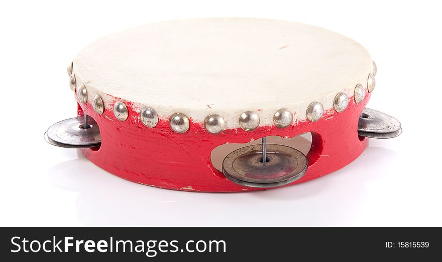 A red wooden tambourine isolated over white