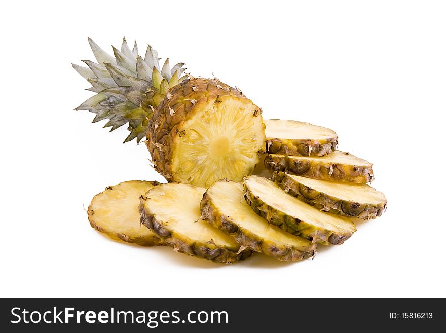 Ripe fruits pineapple with slices isolated on white. Ripe fruits pineapple with slices isolated on white