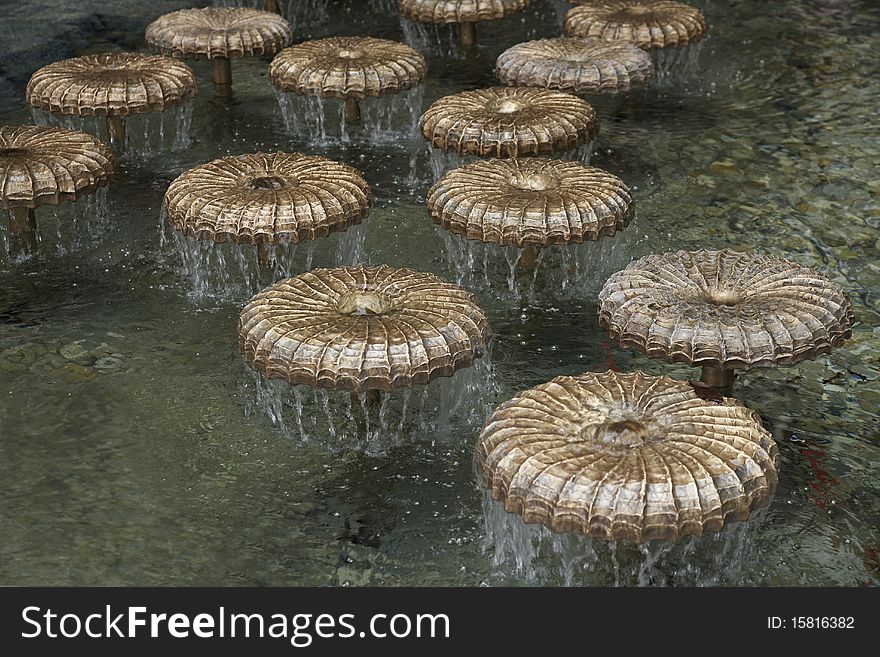 A fountain with bronze mushrooms in Munich, Germany. A fountain with bronze mushrooms in Munich, Germany