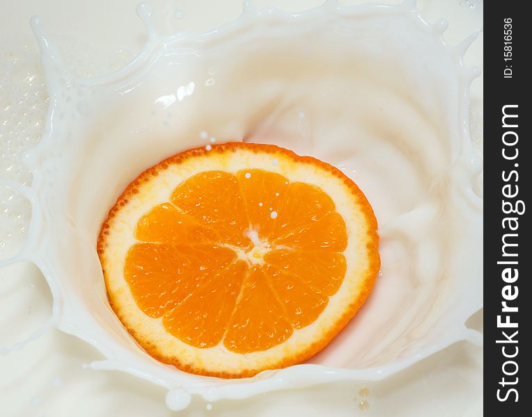 Orange splash in white milk