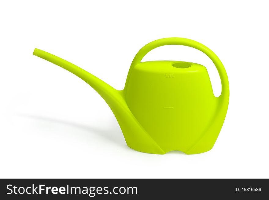 Green watering can on white