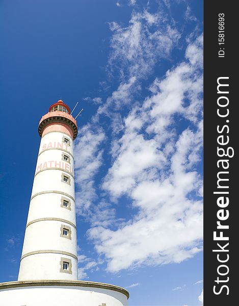 Shot of lighthouse in brittany, france beyond blue, cloudy sky. Shot of lighthouse in brittany, france beyond blue, cloudy sky