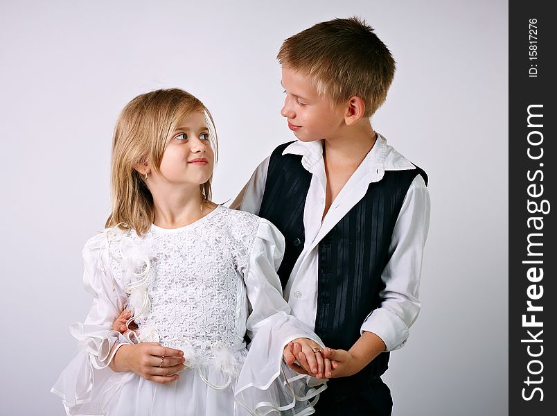 Little bride and groom, studio shot