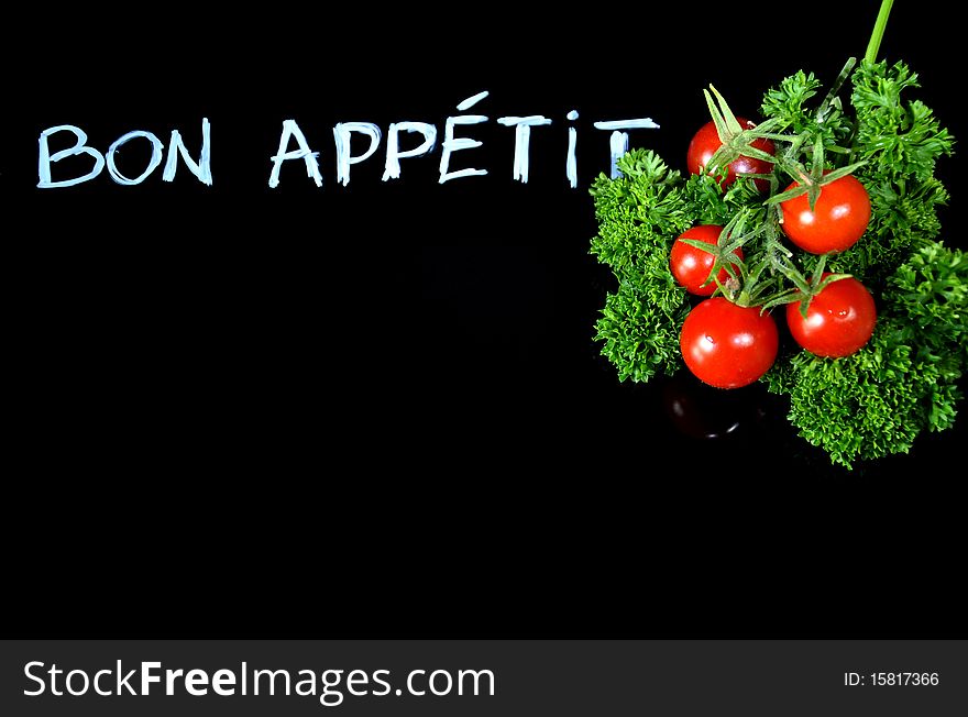 Black board with tomatoes and polite sentence. Black board with tomatoes and polite sentence.