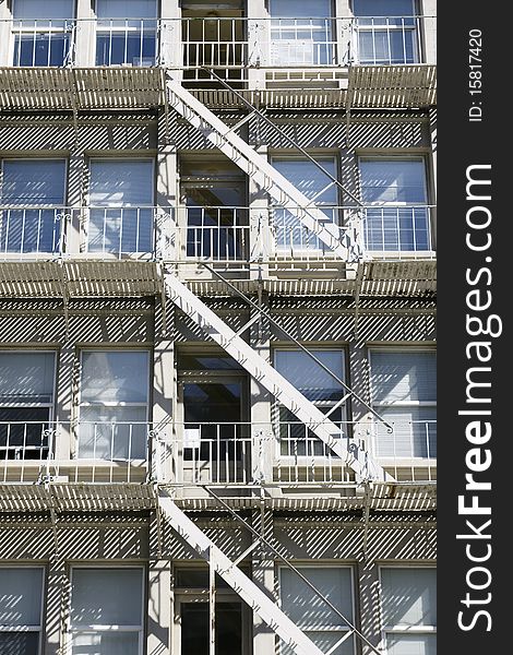 Building exterior fire escape metal staircase. Building exterior fire escape metal staircase.