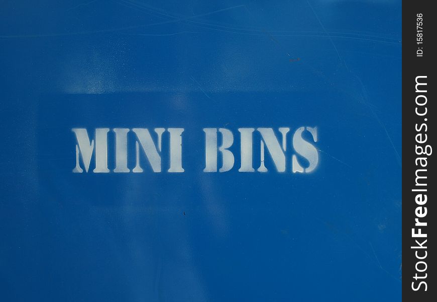 Spray painted Mini Bins offering a contruction style dumpster bin in blue.