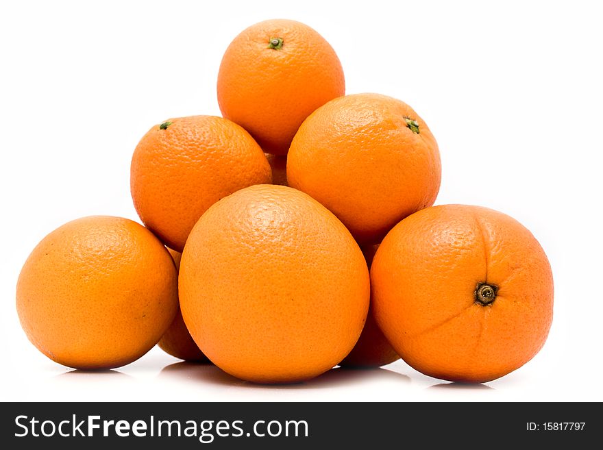 Ripe juicy oranges on a white background