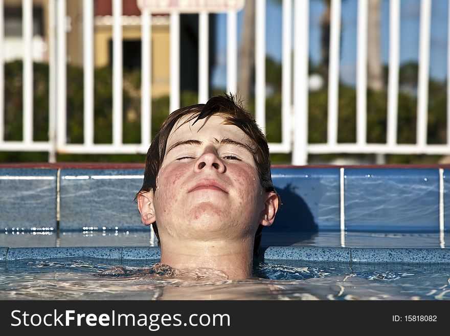 Relaxing child with closed eyes at the pool. Relaxing child with closed eyes at the pool