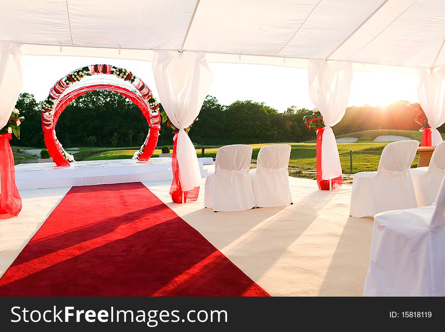 Visiting ceremony with white decoration and red carpet
