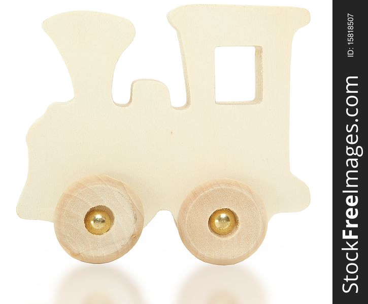 Little wooden toy train engine over white background with reflection. Little wooden toy train engine over white background with reflection.