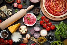 Flat Lay Composition With Pizza Crust And Ingredients Royalty Free Stock Image