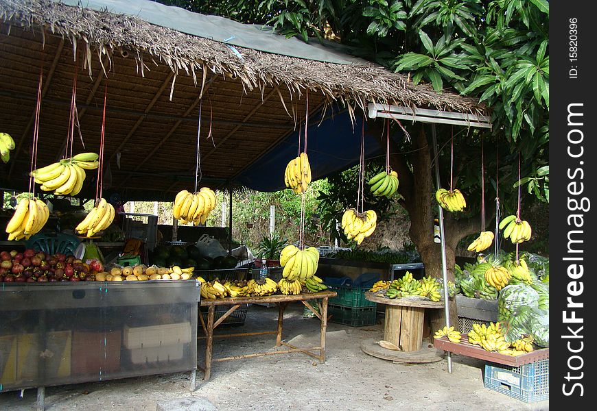 Thai market seeling vegtables and lots of bananas